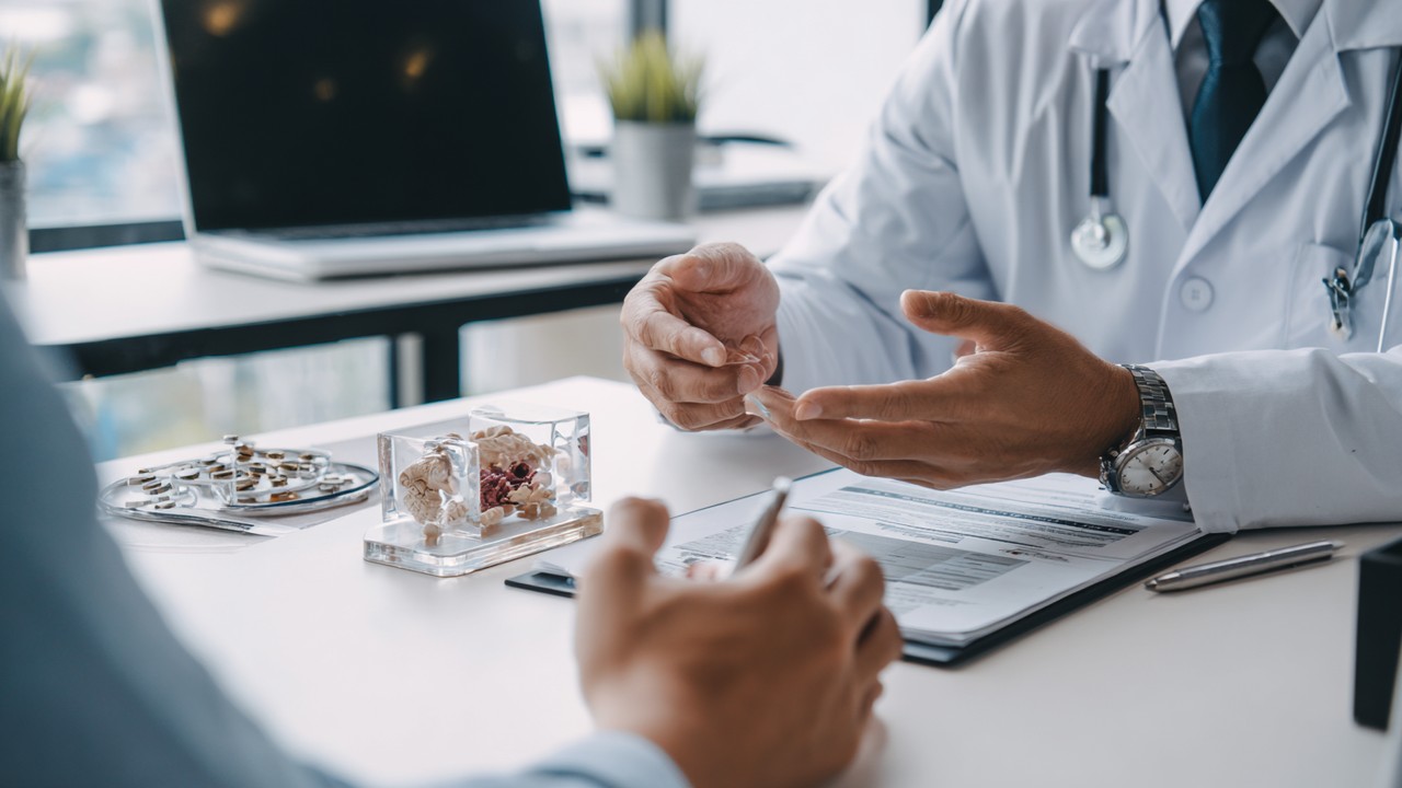 Patient consulting with a hair transplant surgeon in a modern clinic, emphasizing quality, safety, and informed decision-making.