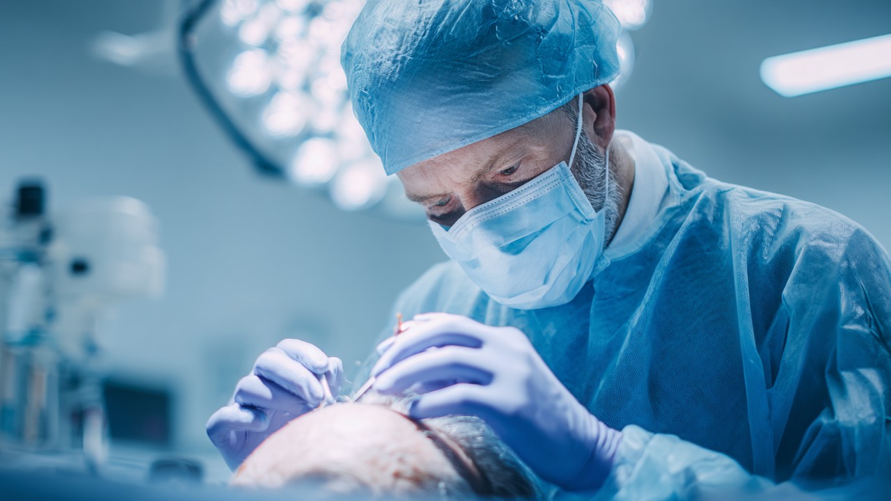 Realistic medical scene of a skilled surgeon performing a hair transplant in a modern clinic with high-tech equipment and bright surgical lighting.