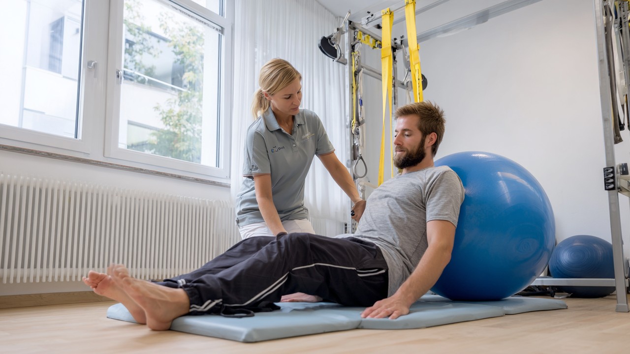 Bright physiotherapy room in a German orthopedic clinic with a patient doing guided rehabilitation exercises using balance balls and resistance bands.